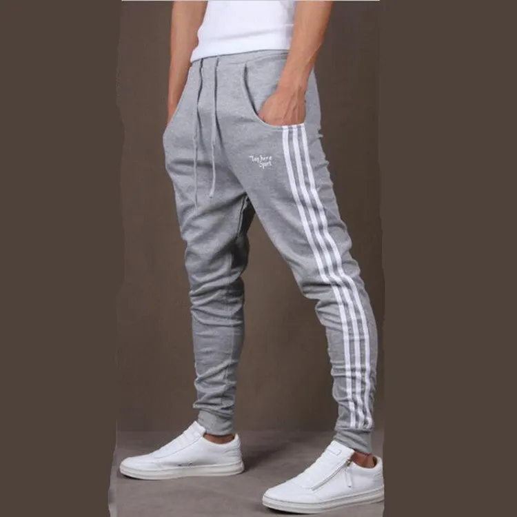 Men's straight leg cotton casual trousers with three-bar side stripe in grey, black, and navy