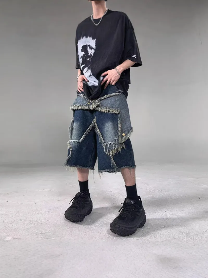Blue denim shorts with frayed detailing and five-pointed star design in loose fit style