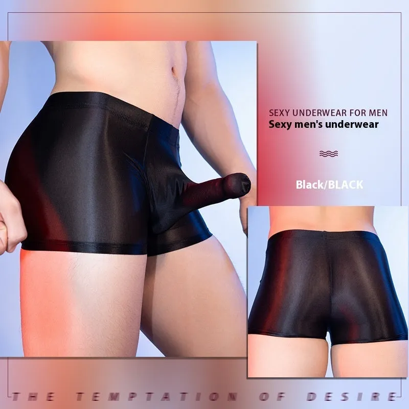 Men's red boxer shorts with a black elephant nose novelty print, showing mid-waist and seamless design.