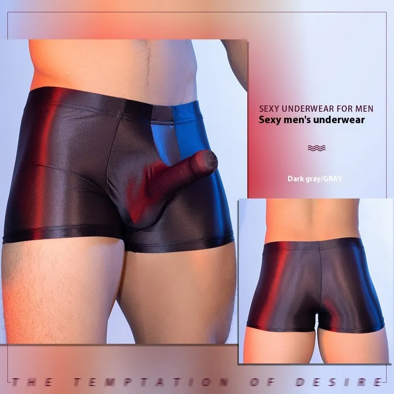 Men's red boxer shorts with a black elephant nose novelty print, showing mid-waist and seamless design.