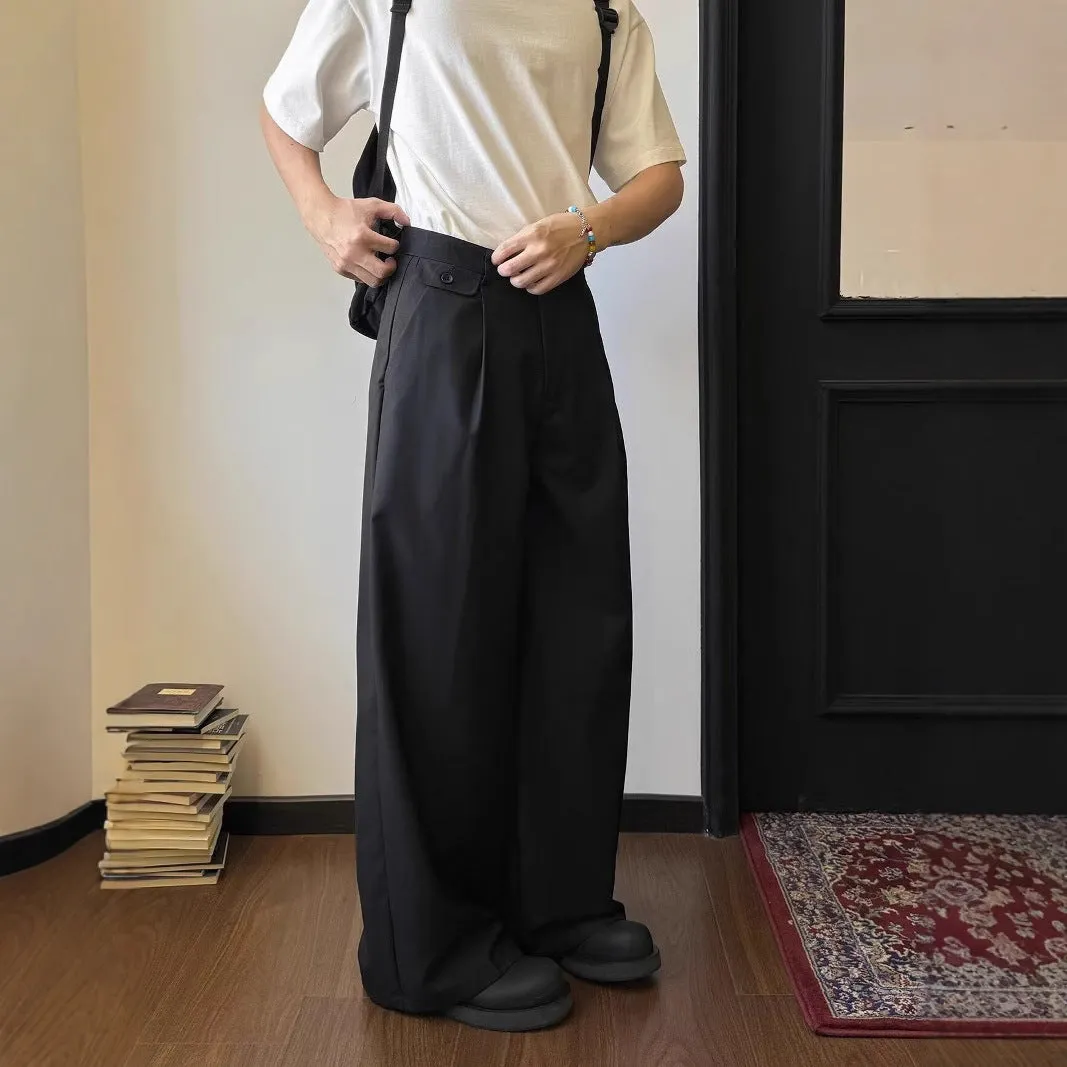 Men's straight-leg wide-leg casual trousers in black, showing loose fit and draping fabric.