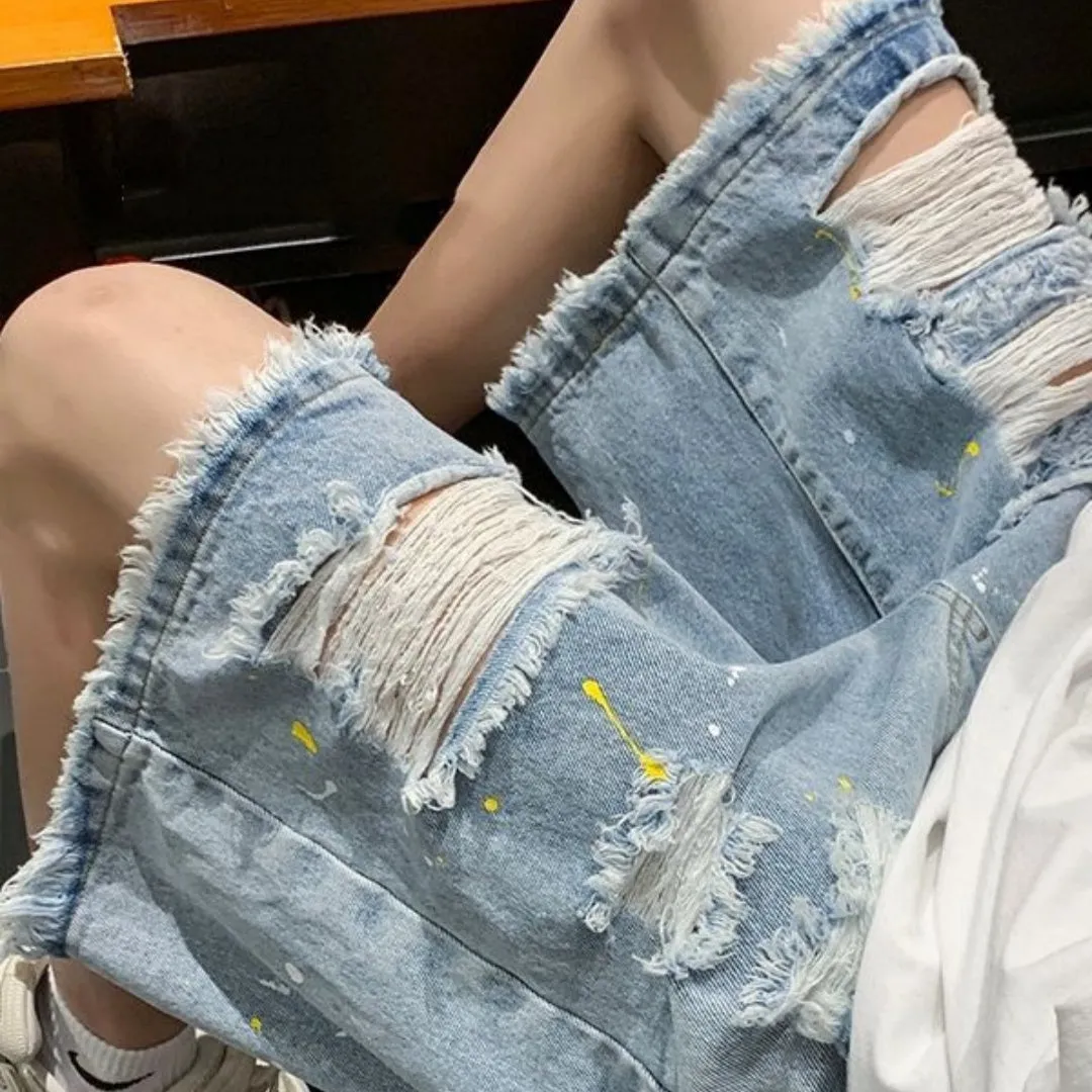 Men's loose fit water washed denim shorts with hole detailing in black and light blue colours