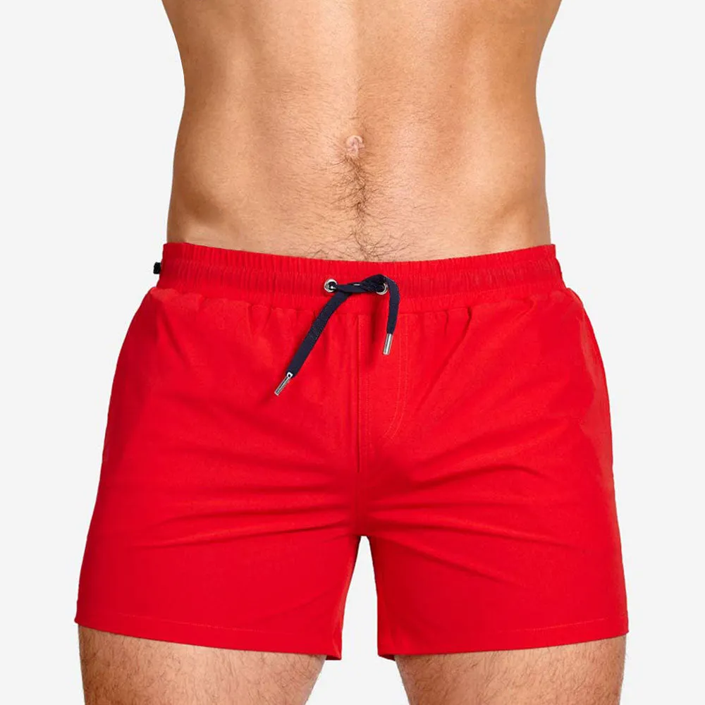 Men's solid colour polyester sports shorts with mesh lining in six colour options