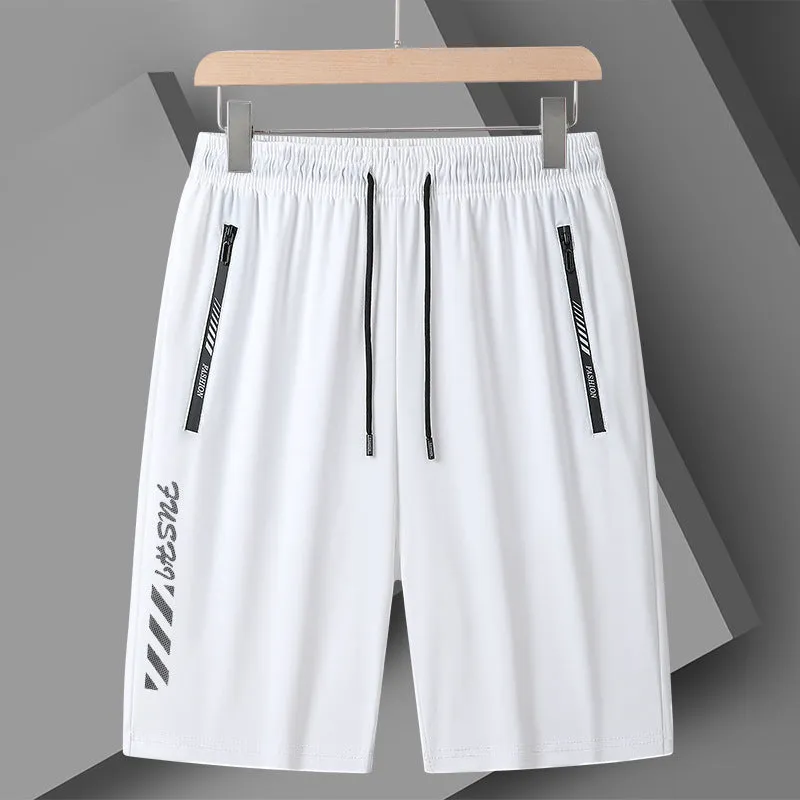 Man wearing black loose-fit quick-drying nylon sports shorts with an elastic waistband.