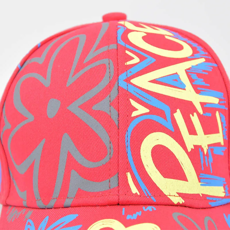 Cotton twill alphabet baseball cap in red, black, white, and pink options with adjustable strap