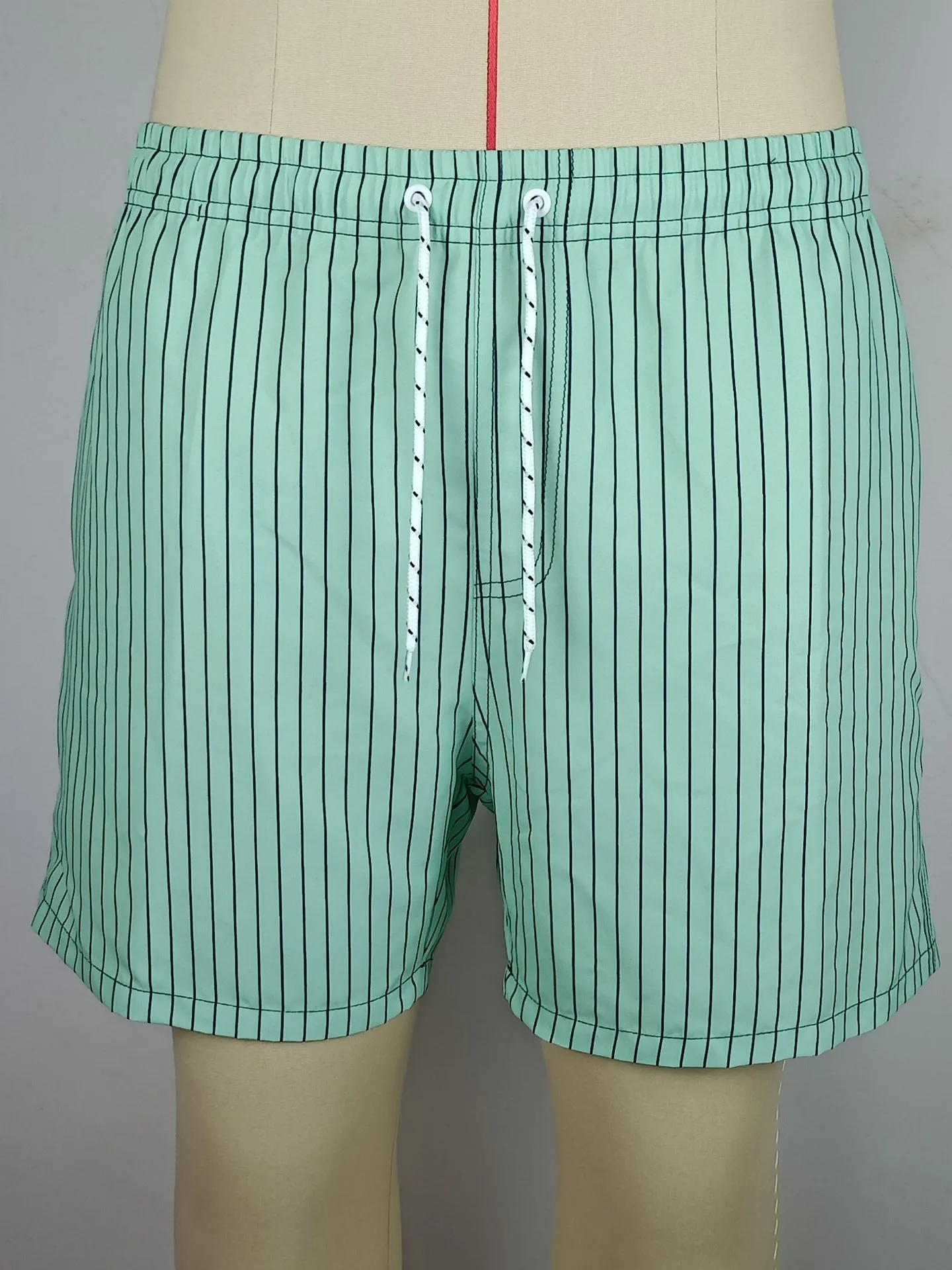 Polyester fibre striped beach shorts with straight leg openings and triangle lining in multiple colours