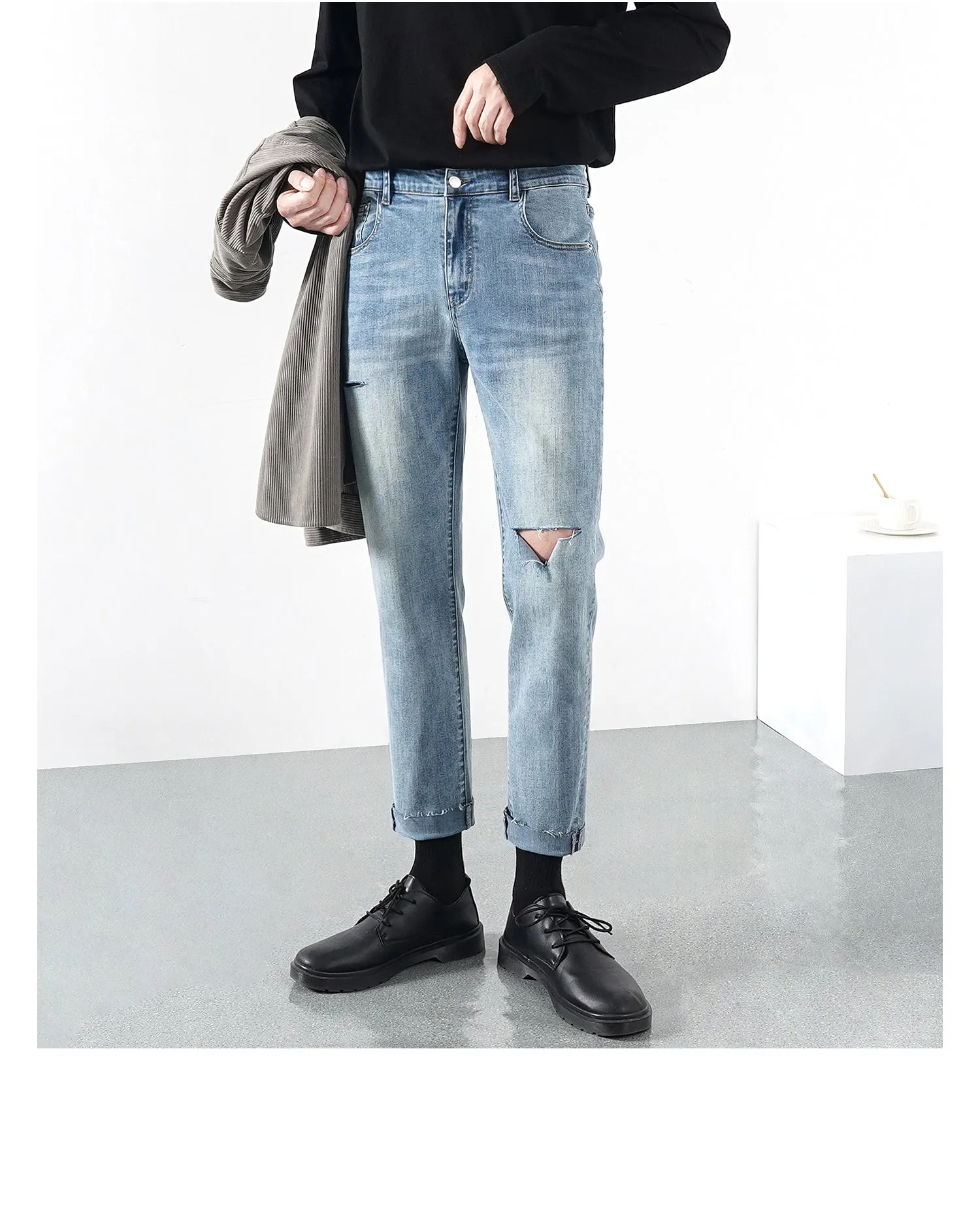 Men's light summer ripped jeans in blue with microelastic stretch denim, front view