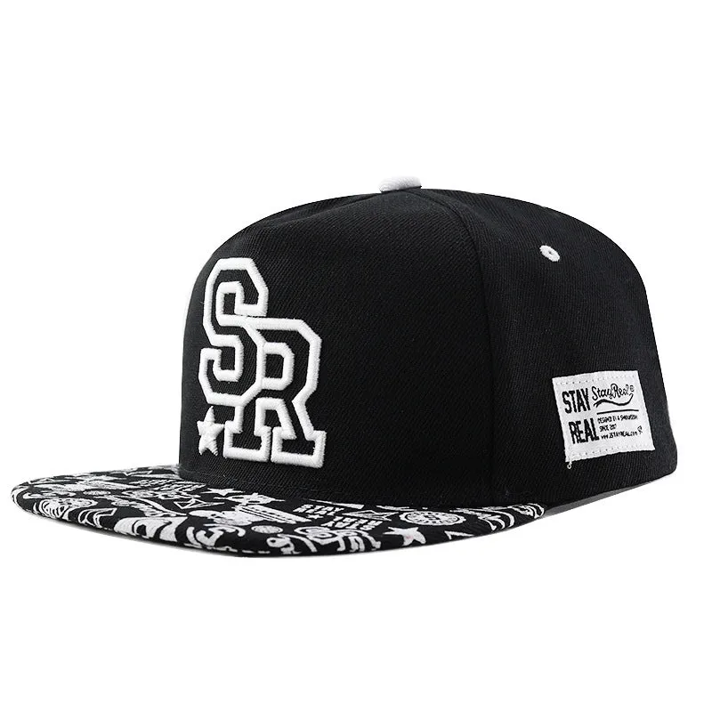 Black cotton baseball cap with white embroidered lettering on the front, showing adjustable back strap.