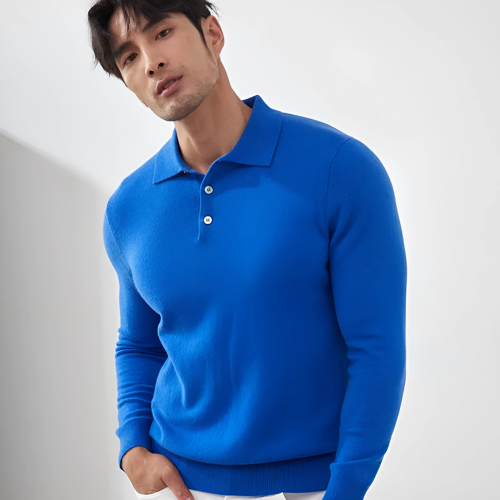 A sapphire blue men's cashmere pullover sweater with a polo collar, shown in a loose fit.