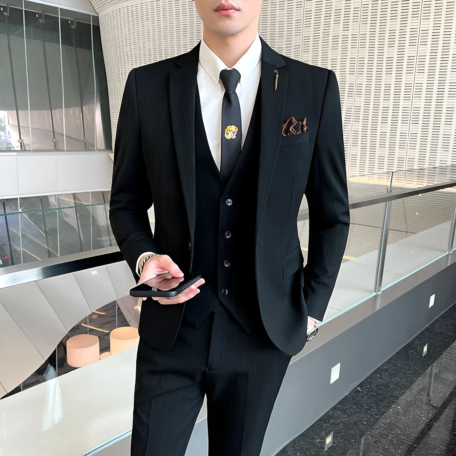 Men's striped three-piece suit set in black slim fit with jacket, vest, and trousers on a hanger