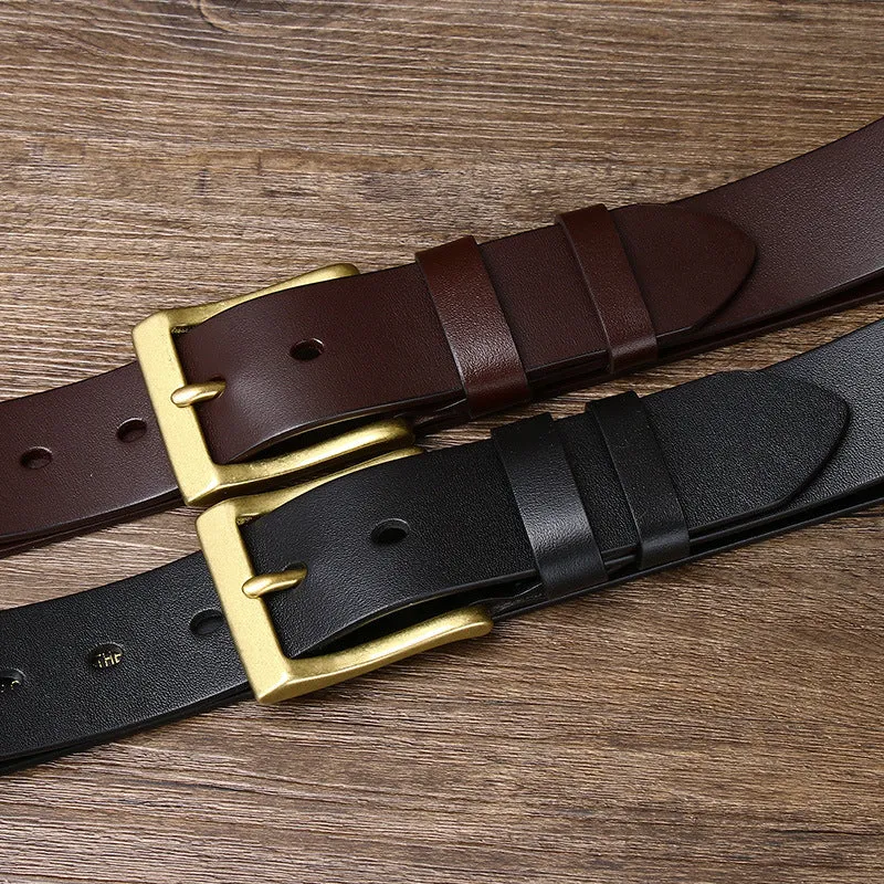 Men's brown leather belt with copper pin buckle on a plain background showing glossy first layer cowhide finish