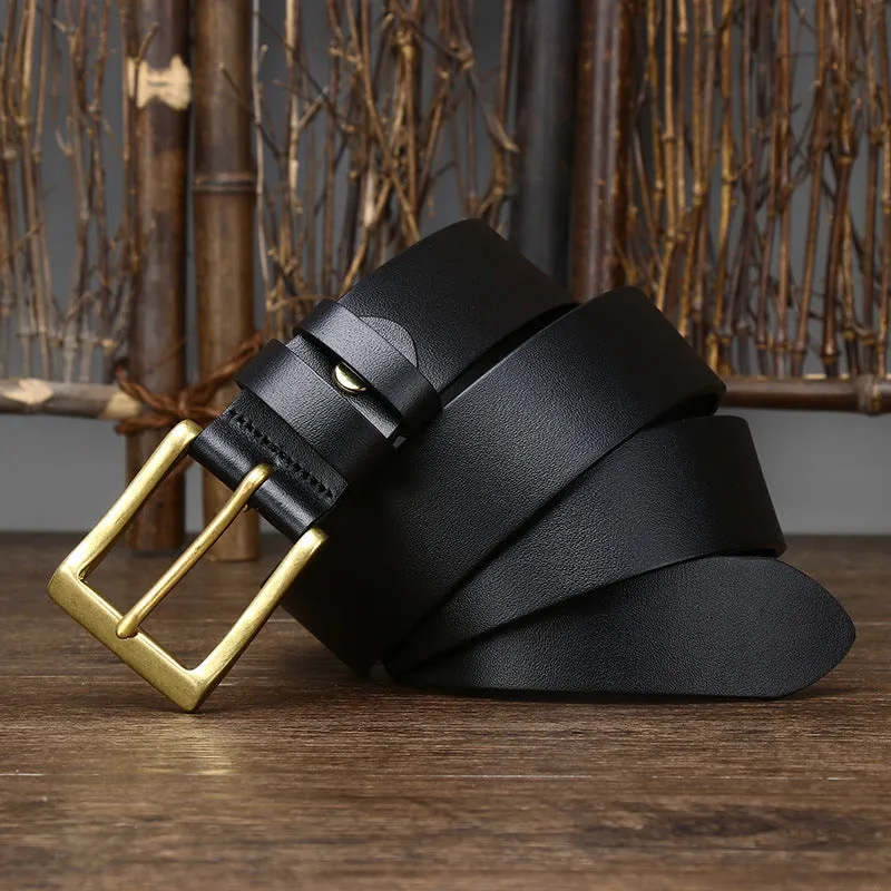 Men's brown leather belt with copper pin buckle on a plain background showing glossy first layer cowhide finish