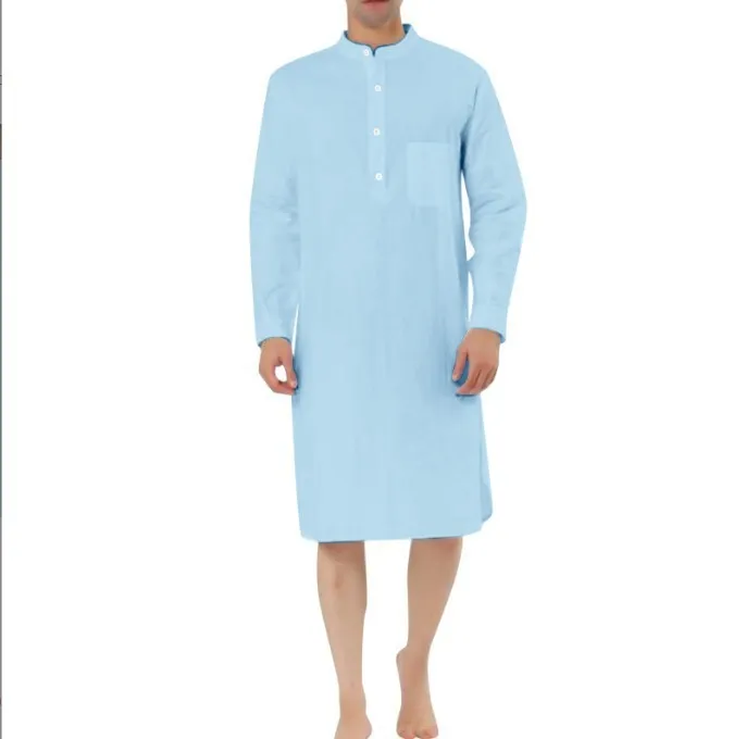 A man wearing a dark blue cotton shirt-style full-length robe for loungewear.