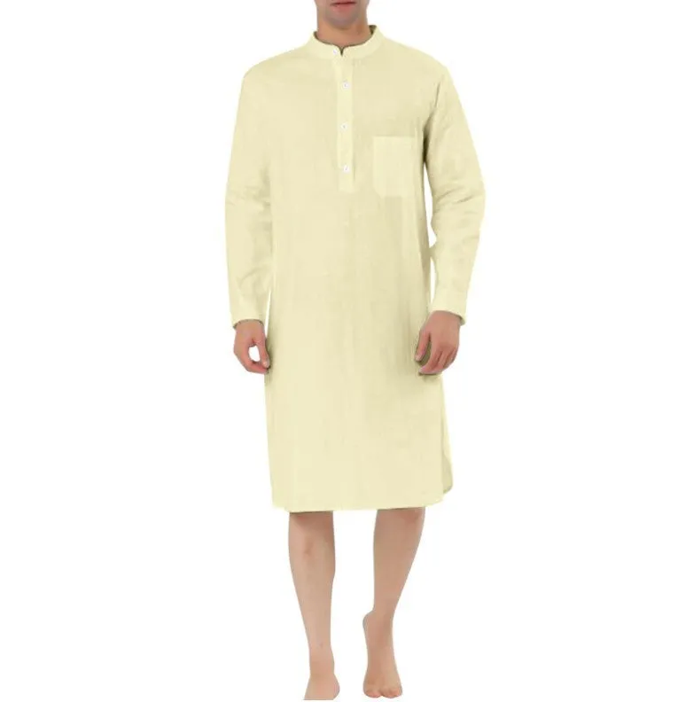 A man wearing a dark blue cotton shirt-style full-length robe for loungewear.