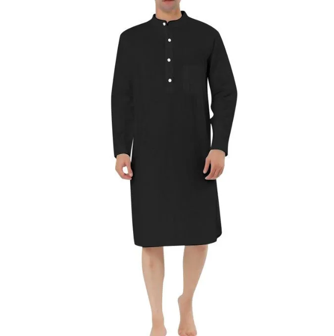 A man wearing a dark blue cotton shirt-style full-length robe for loungewear.