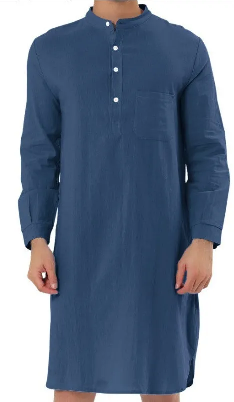 A man wearing a dark blue cotton shirt-style full-length robe for loungewear.