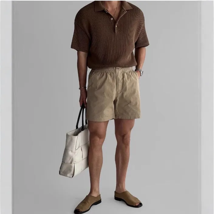 Men's loose cotton sports shorts in black colour showing athletic design for summer wear