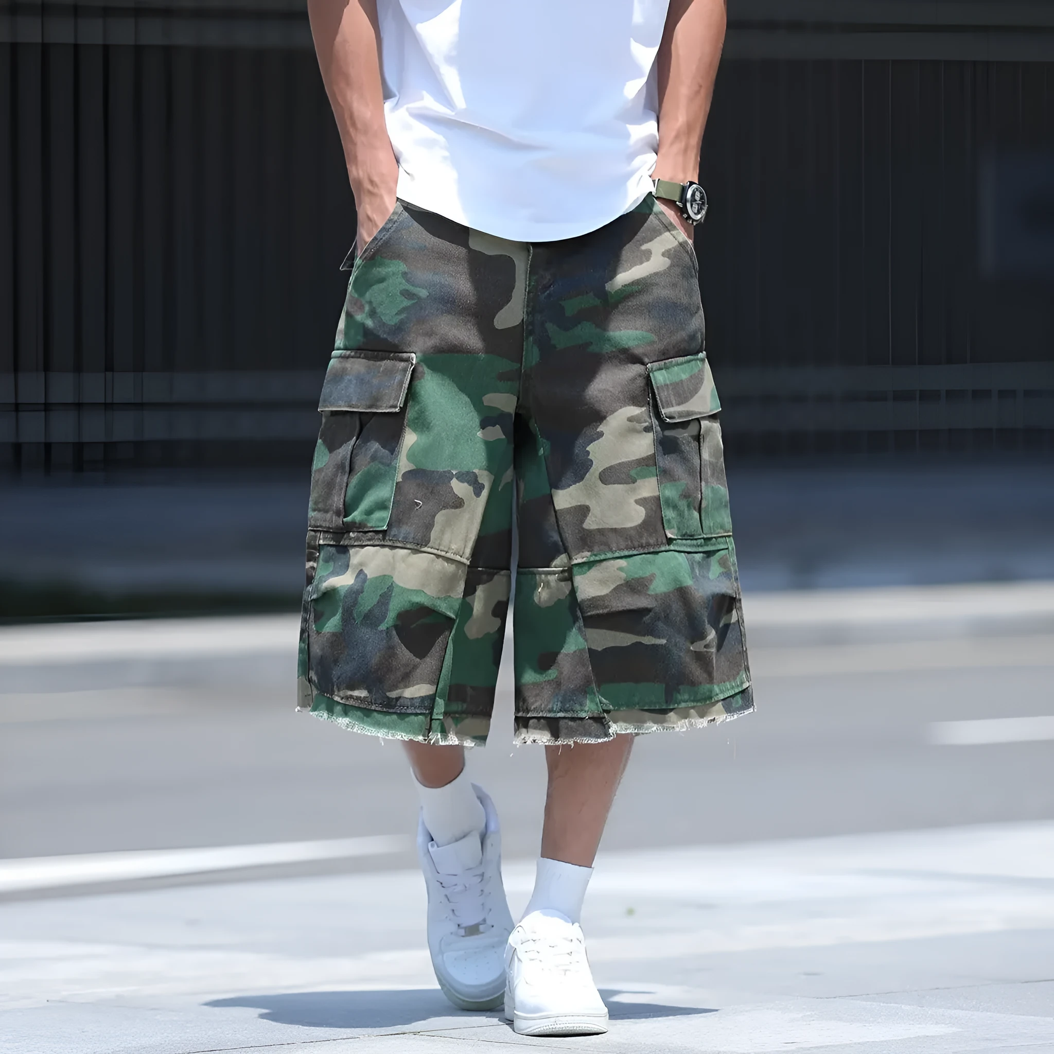 Man wearing loose, cropped camouflage shorts in a khaki colourway, showcasing the summer workwear style.
