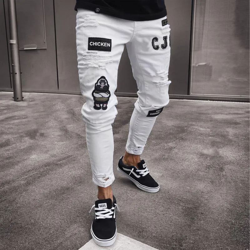 Men's slim fit embroidered jeans in blue with mid rise and zipper fly
