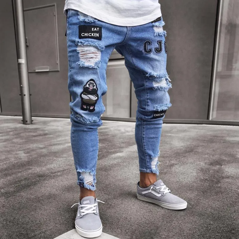 Men's slim fit embroidered jeans in blue with mid rise and zipper fly