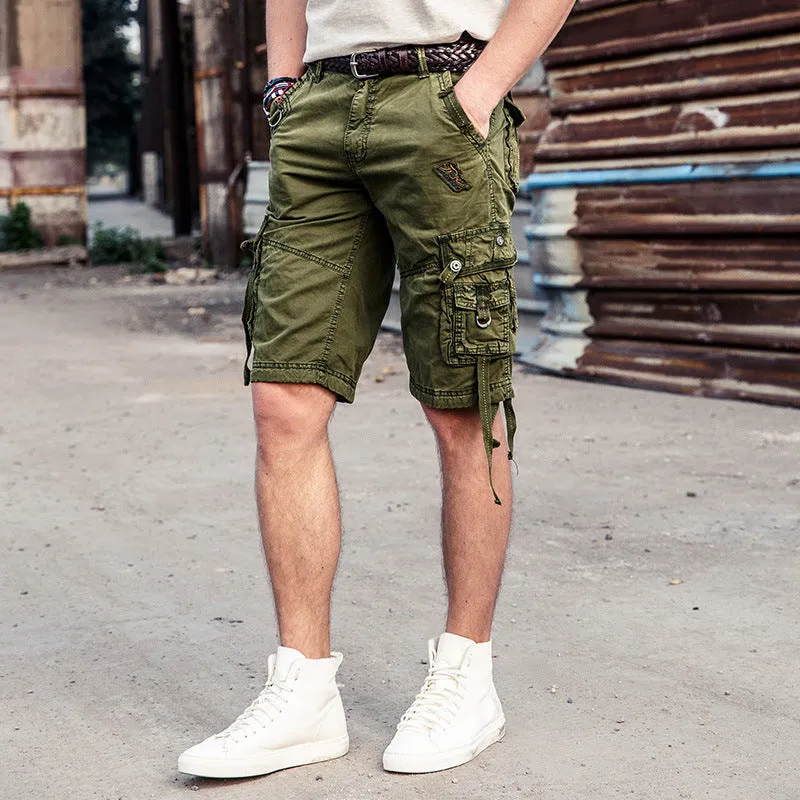Multi-bag tooling shorts in 100% cotton with multiple pockets, straight leg, and zipper fly in army green