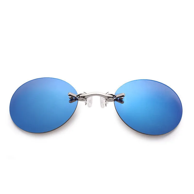 Frameless clip-nose round sunglasses in retro style with metal frame on a person