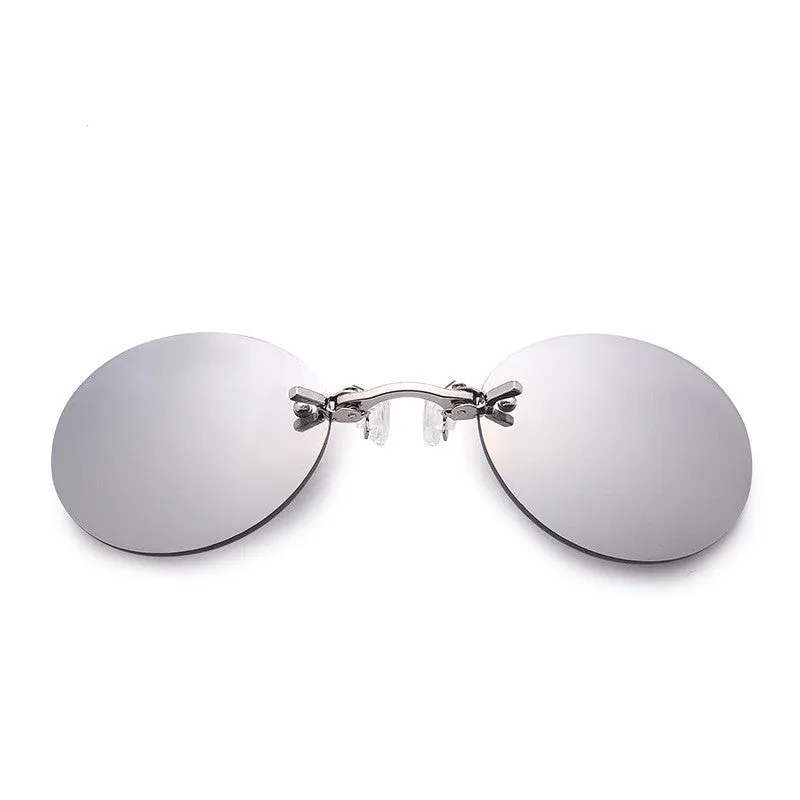 Frameless clip-nose round sunglasses in retro style with metal frame on a person