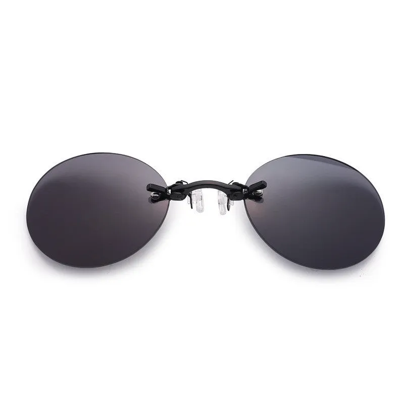 Frameless clip-nose round sunglasses in retro style with metal frame on a person