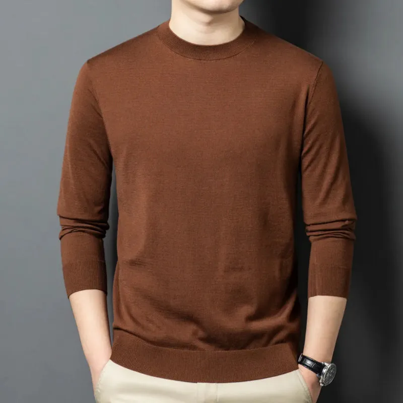 Man wearing a round neck grey wool and mulberry silk pullover sweater with long sleeves.