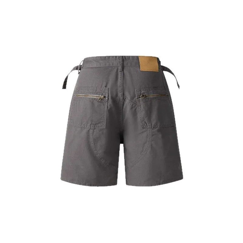 Retro loose-fit washed cotton shorts in camouflage with a zipper pocket.