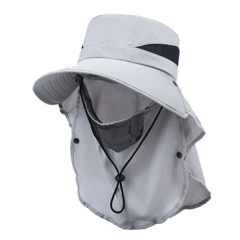 Men's grey fisherman hat with wide brim, shown from the side on a wooden post outdoors.