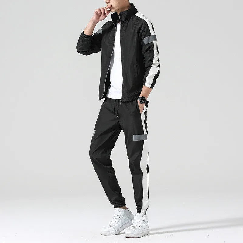 Reflective track suit in black polyester with reflective strips, front view