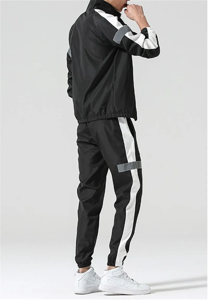 Reflective track suit in black polyester with reflective strips, front view