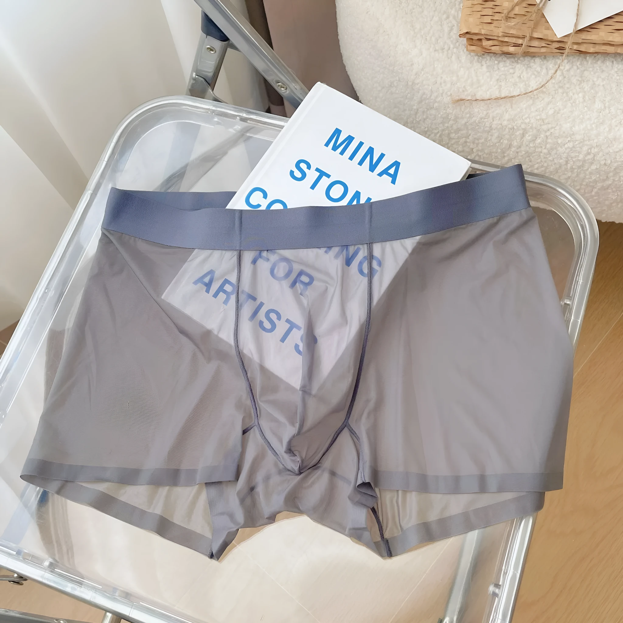 Men's thin breathable seamless boxer shorts in light brown colour on a grey background