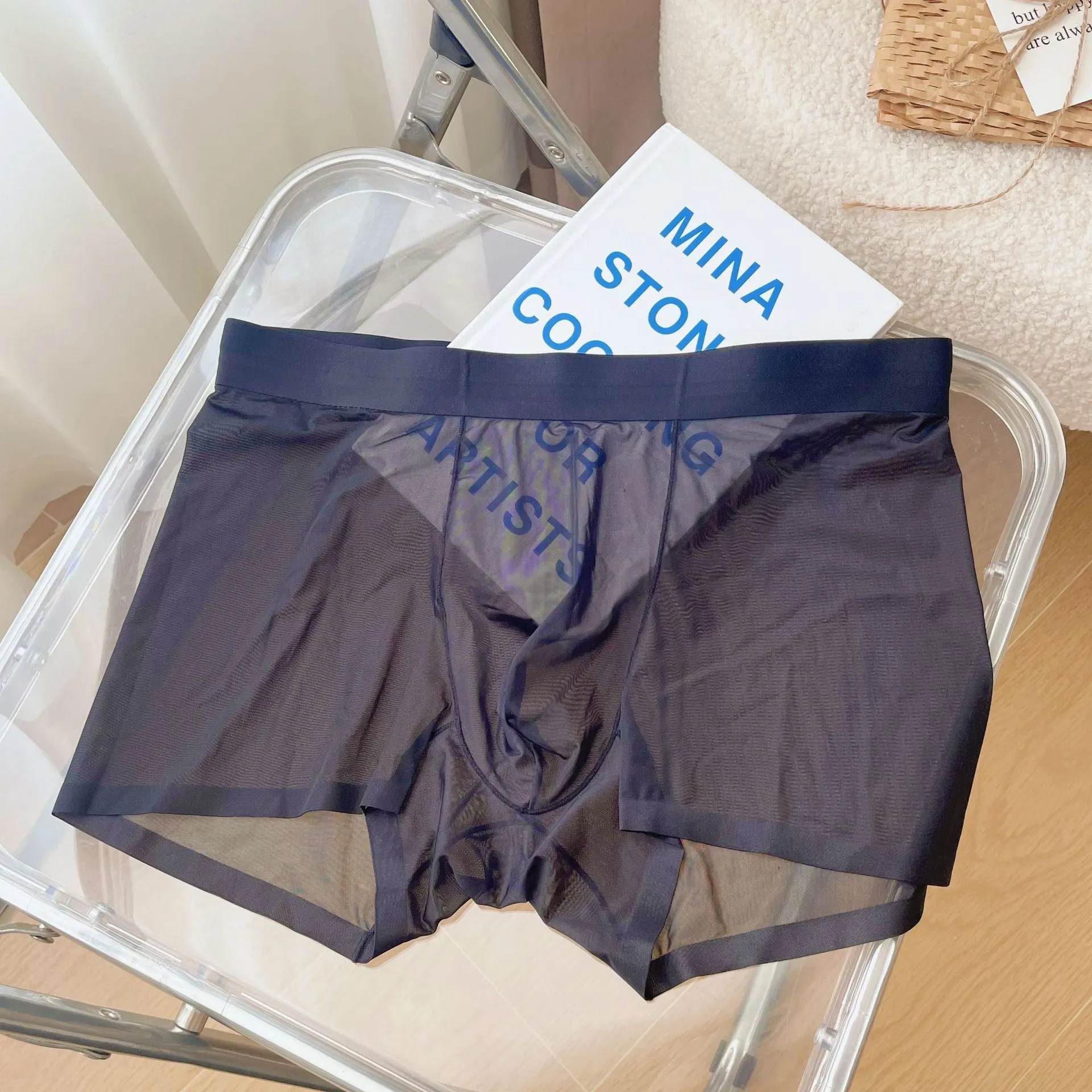 Men's thin breathable seamless boxer shorts in light brown colour on a grey background