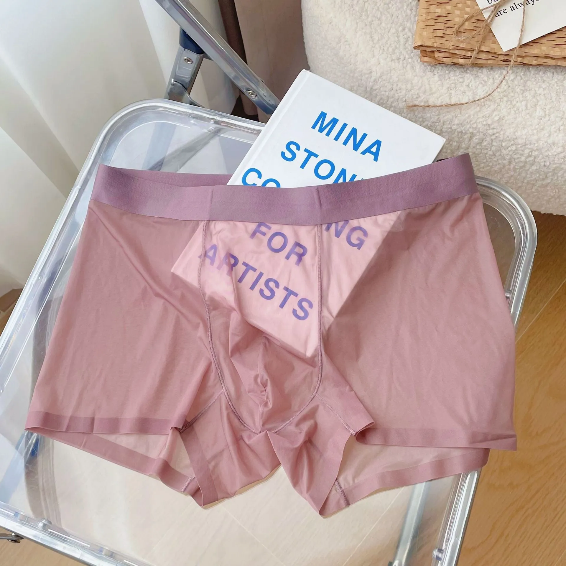 Men's thin breathable seamless boxer shorts in light brown colour on a grey background
