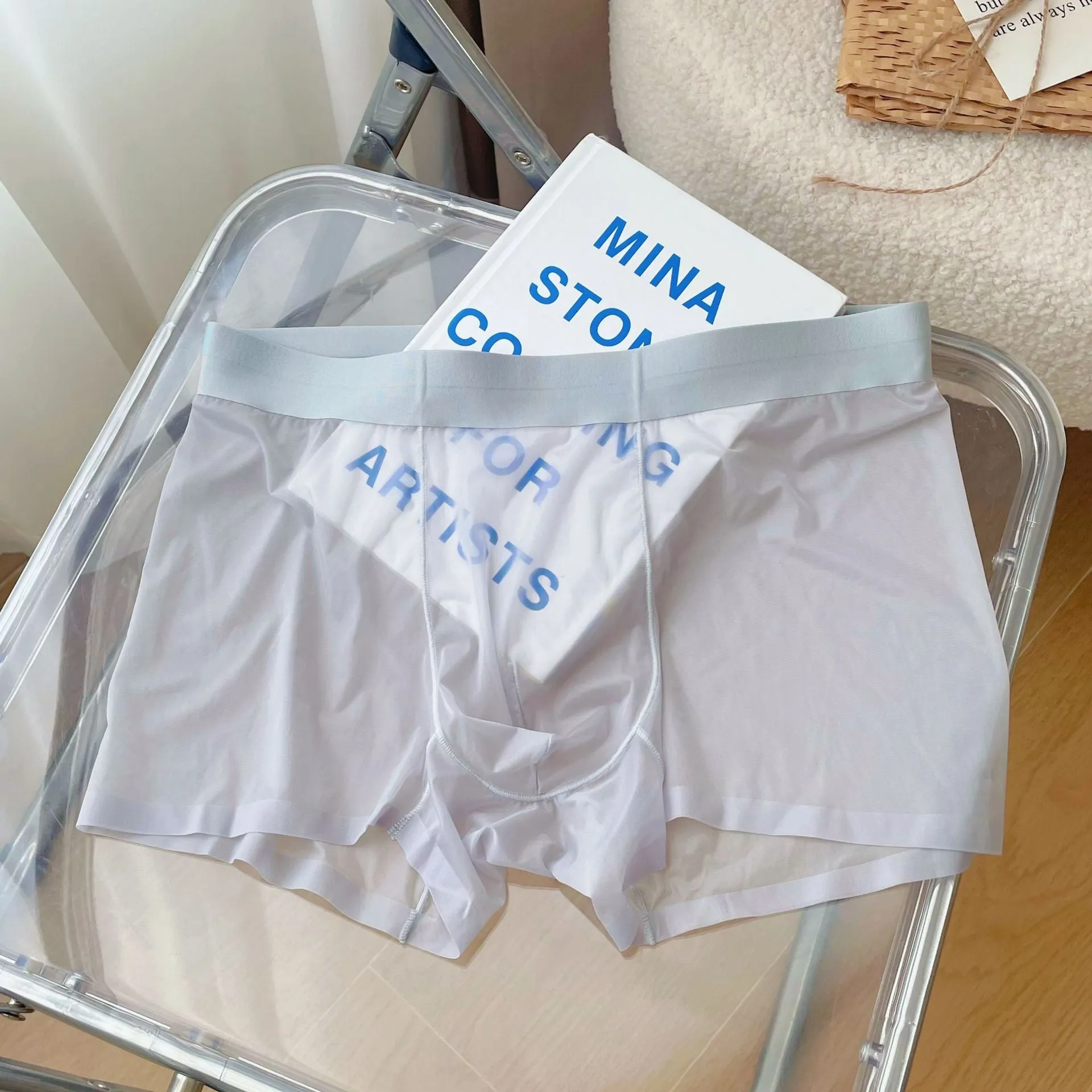 Men's thin breathable seamless boxer shorts in light brown colour on a grey background