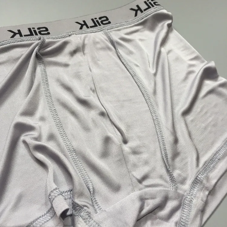 Men's loose fit silk shorts in navy blue, skin colour, and silver grey options with mid-waist design