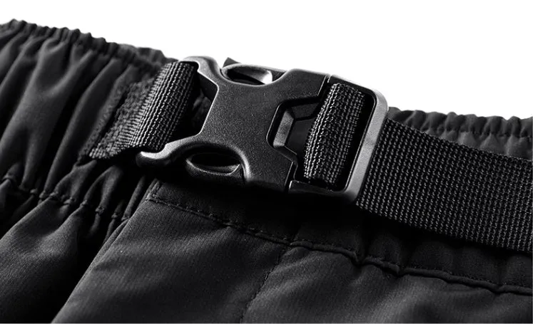 Men's black multi pocket cargo pants in polyester, loose fit, mid-waist style, on white background