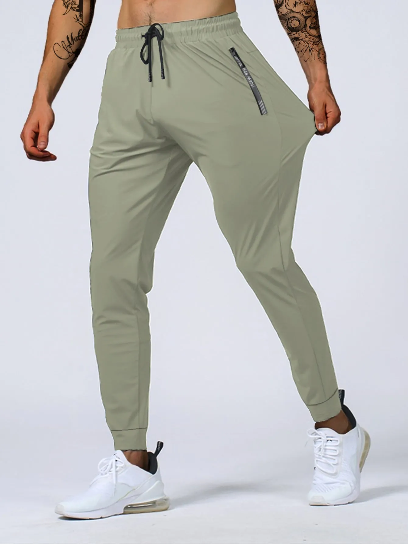 Men's jogging sports pants in nylon blend, mid waist loose fit, available in black gray khaki blue sizes L to 7XL