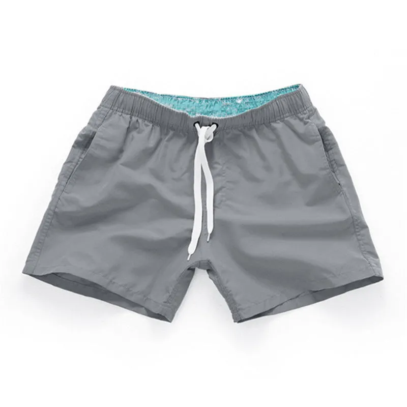 Men's straight leg beach shorts in multiple colours including fluorescent yellow for surfing