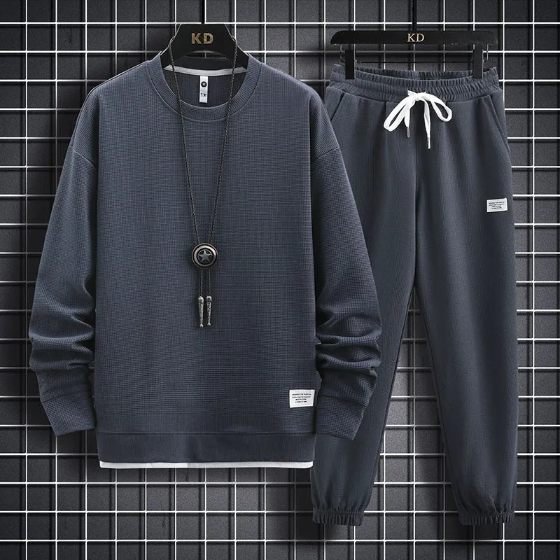 Men's wool-blend long sleeve tracksuit set in dark grey, front view, on model