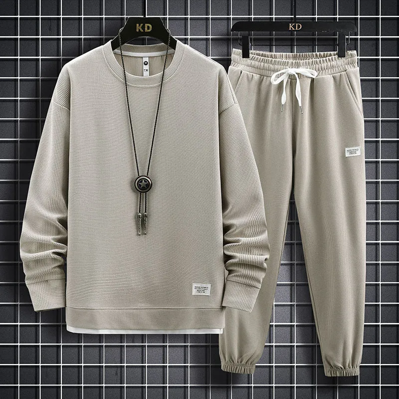 Men's wool-blend long sleeve tracksuit set in dark grey, front view, on model