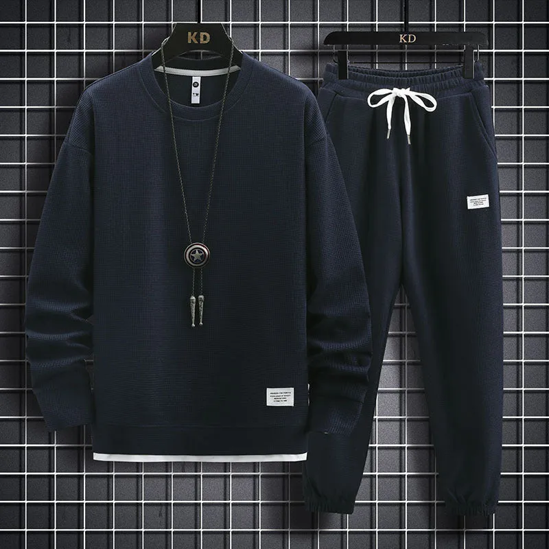 Men's wool-blend long sleeve tracksuit set in dark grey, front view, on model