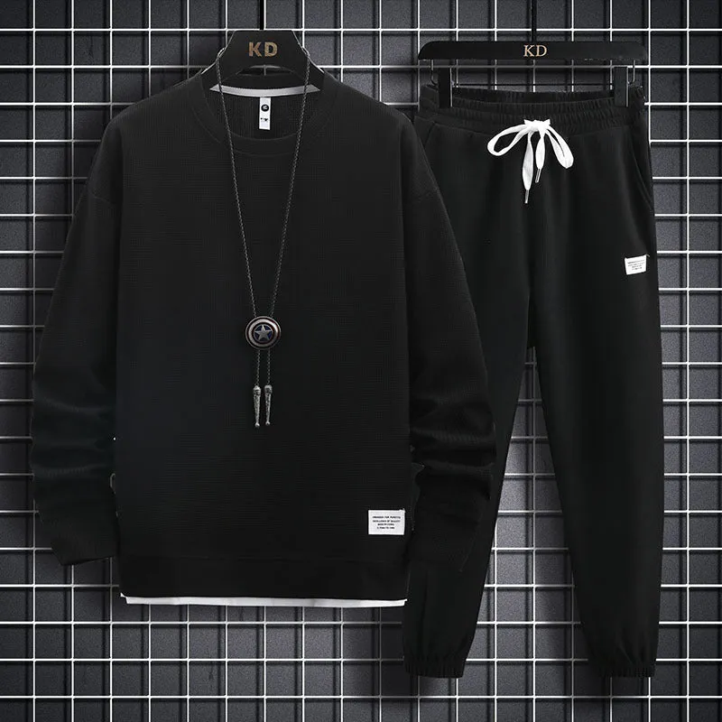Men's wool-blend long sleeve tracksuit set in dark grey, front view, on model
