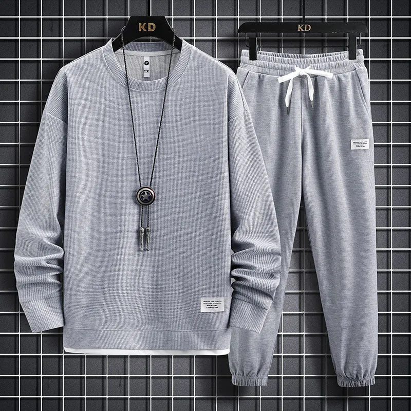 Men's wool-blend long sleeve tracksuit set in dark grey, front view, on model