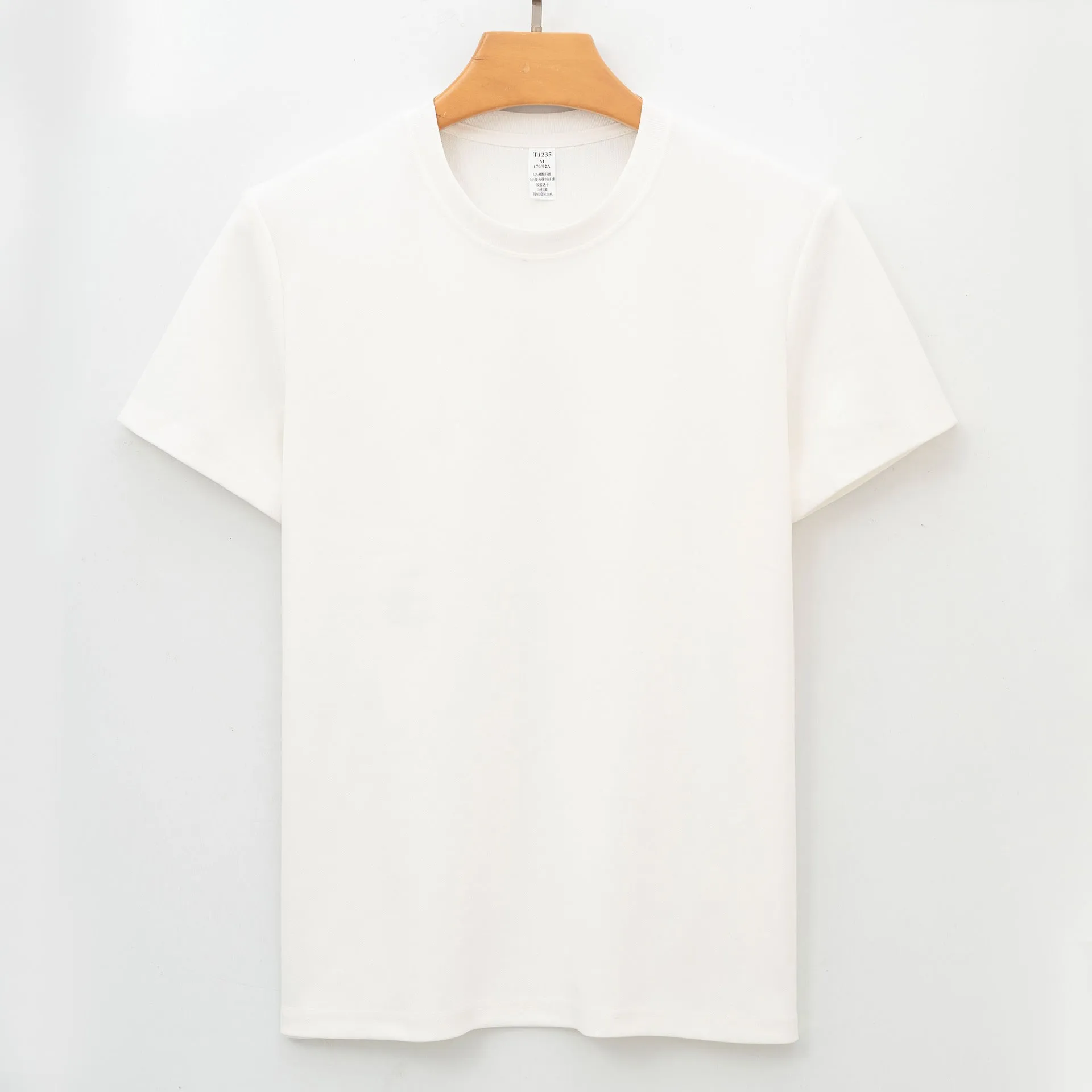 Men's solid colour short-sleeve antibacterial quick-dry T-shirt on a hanger.