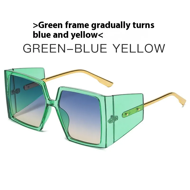Large square frame sunglasses with UV400 lenses in seven colour options on a wooden surface.