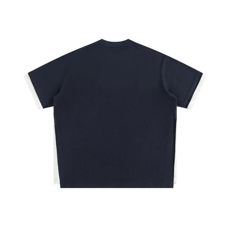 Retro loose waffle short-sleeved t-shirt with embroidered alphabet design in navy blue.