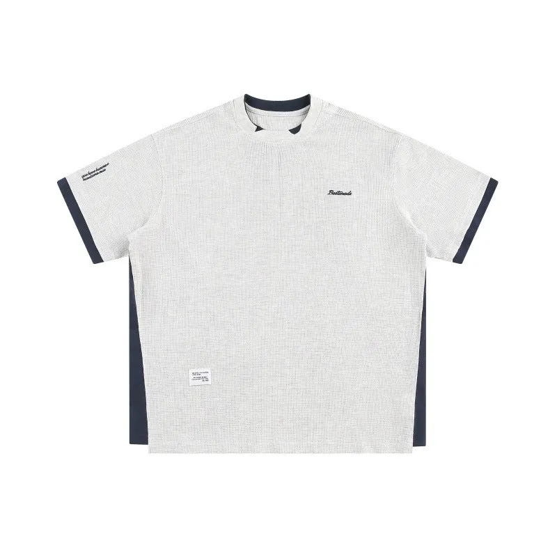 Retro loose waffle short-sleeved t-shirt with embroidered alphabet design in navy blue.